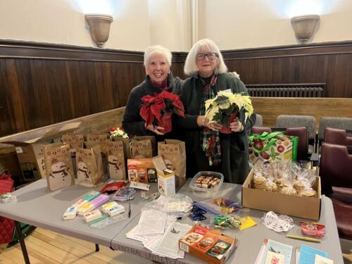 Ladies putting together gift bags and poinsettias for our shut ins. 