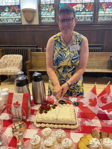 Lisa Folkins cutting the cake 